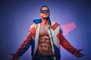 male strip shows Manhattan: Portrait of handsome young sportsman in retro jacket and sunglasses.