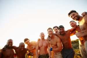 best male strippers in New York: Masculine energy. Cropped portrait of a group of macho male friends in the outdoors